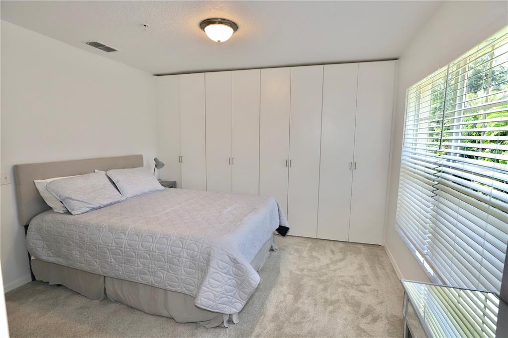 Undisclosed Address Sarasota, FL 34238 - Photo 13 of 56 a bedroom with a bed and a window