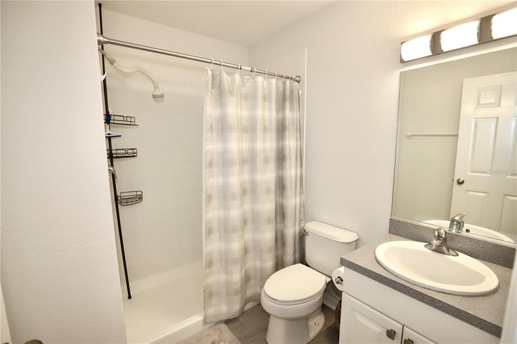 Undisclosed Address Sarasota, FL 34238 - Photo 15 of 56 a bathroom with a sink a toilet and shower