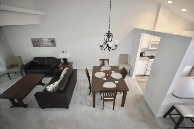 a view of a glass door with a balcony from a window