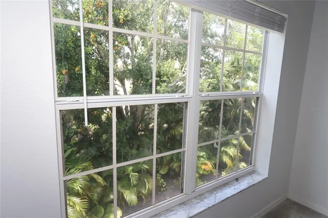 a bathroom with a sink toilet and window