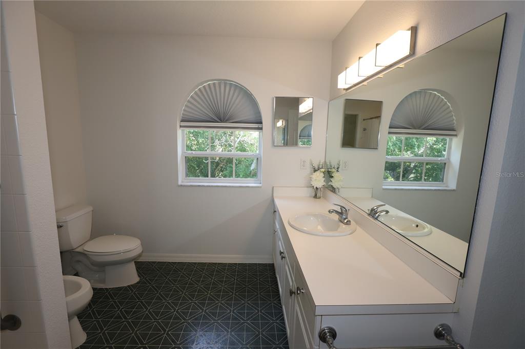 Undisclosed Address Sarasota, FL 34238 - Photo 23 of 56 a bathroom with a sink toilet and window