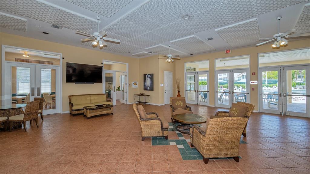 Undisclosed Address Sarasota, FL 34238 - Photo 28 of 56 a living room with furniture and a flat screen tv