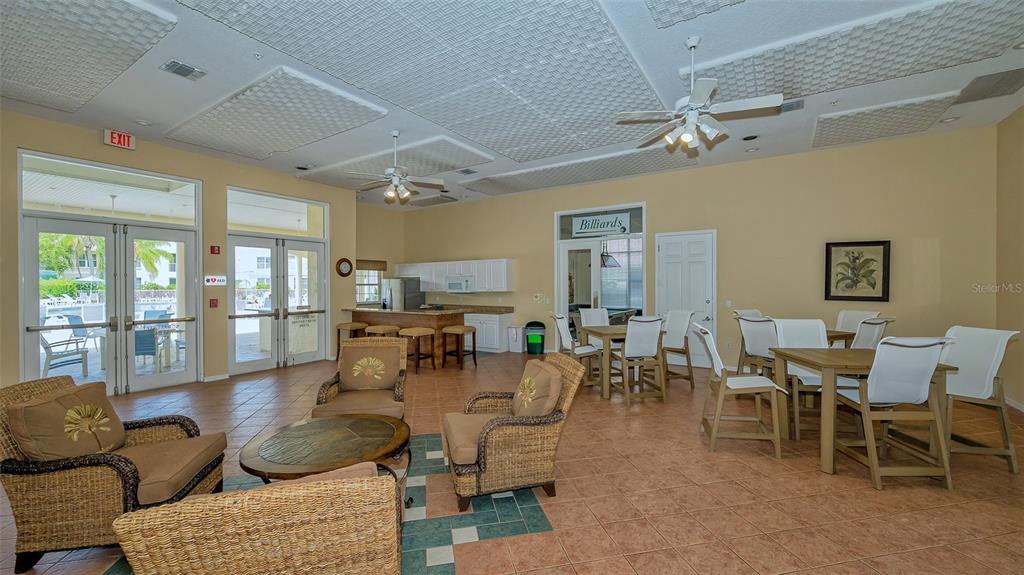Undisclosed Address Sarasota, FL 34238 - Photo 29 of 56 a living room with lots of furniture and a view of kitchen