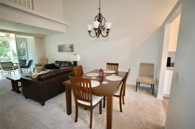 a living room with furniture a window and a flat screen tv