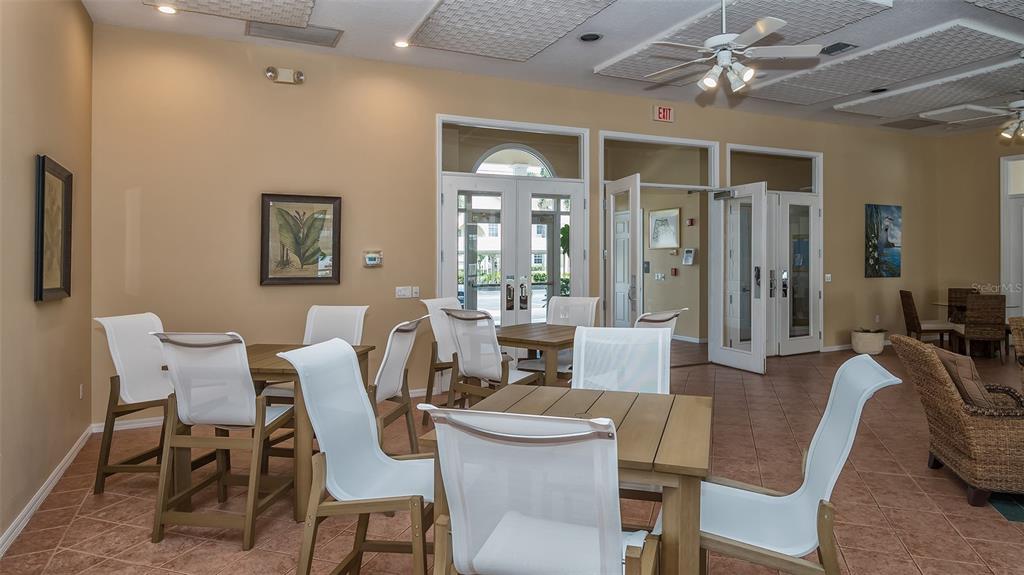 Undisclosed Address Sarasota, FL 34238 - Photo 32 of 56 a view of a dining room with furniture wooden floor and chandelier