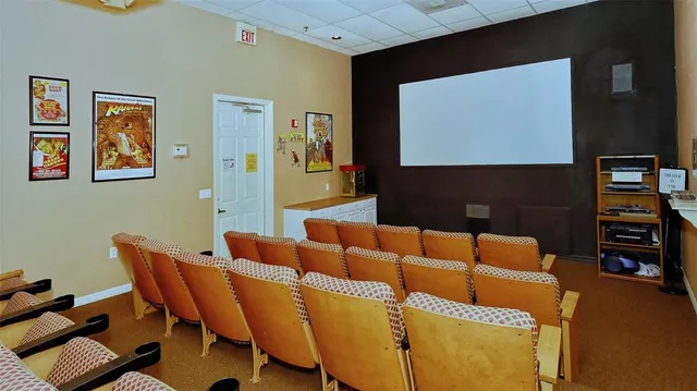 a view of a house with a yard patio and swimming pool