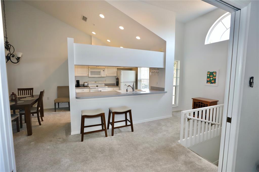 Undisclosed Address Sarasota, FL 34238 - Photo 7 of 56 a dining room with furniture and a kitchen view