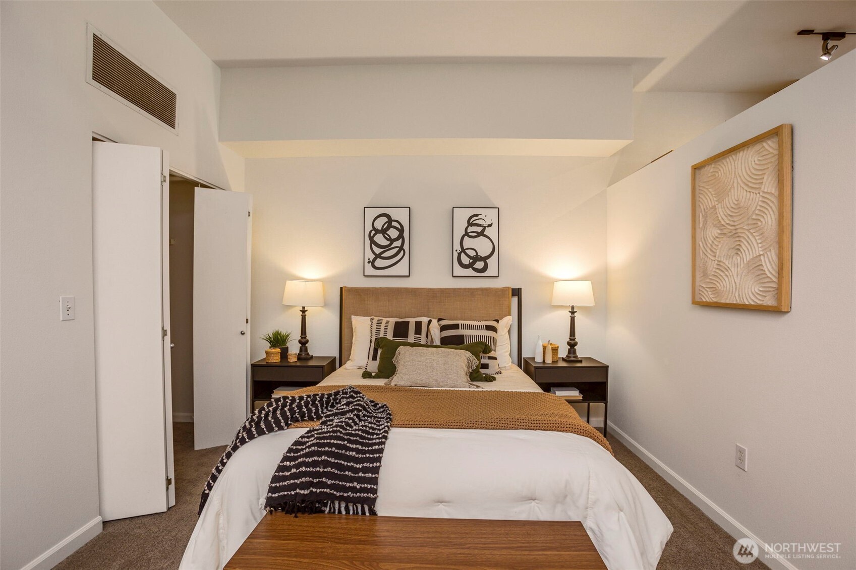 17 West Mercer Street, Unit 218 Seattle, WA 98119 - Photo 16 of 33 a bed room with a bed and a night stand