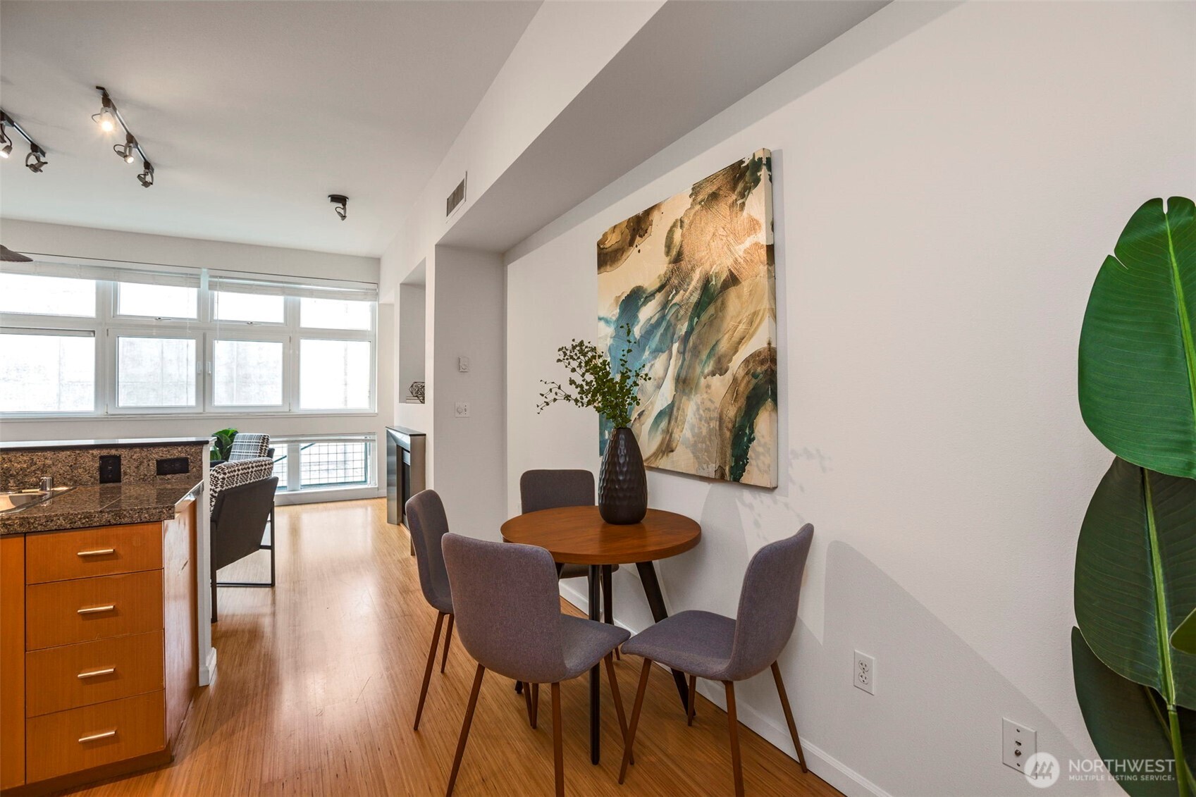 17 West Mercer Street, Unit 218 Seattle, WA 98119 - Photo 22 of 33 a dining room with furniture and wooden floor