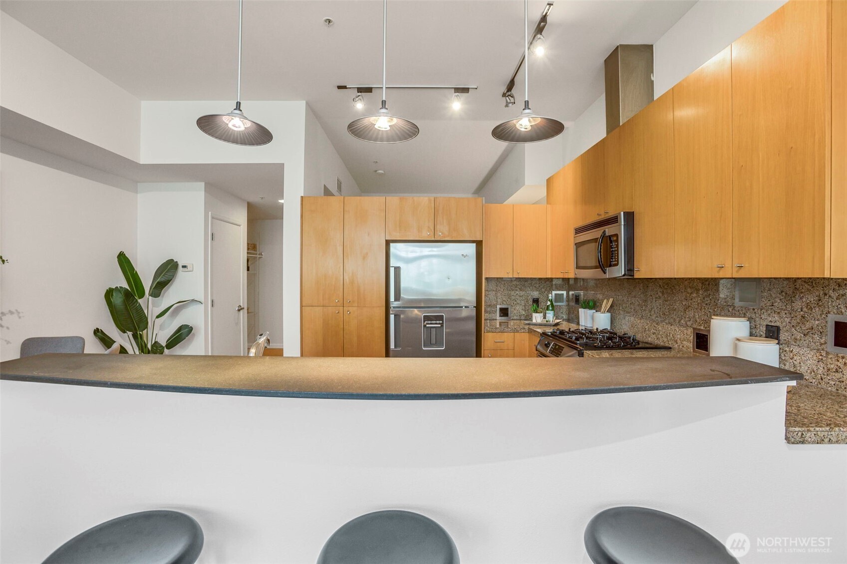 17 West Mercer Street, Unit 218 Seattle, WA 98119 - Photo 6 of 33 a bathroom with a sink and a mirror