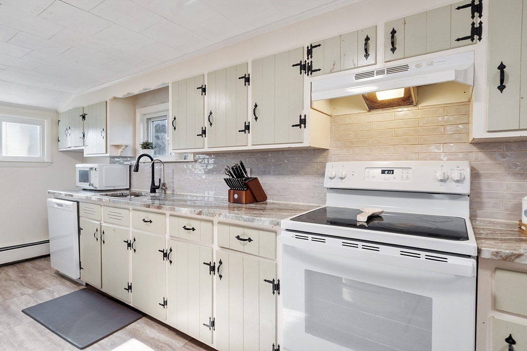 2 Grove Street Methuen, MA 01844 - Photo 12 of 38 a kitchen with cabinets appliances and a counter space