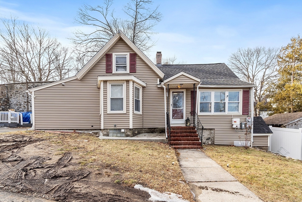 2 Grove Street Methuen, MA 01844 - Photo 2 of 38 a front view of a house with a garden