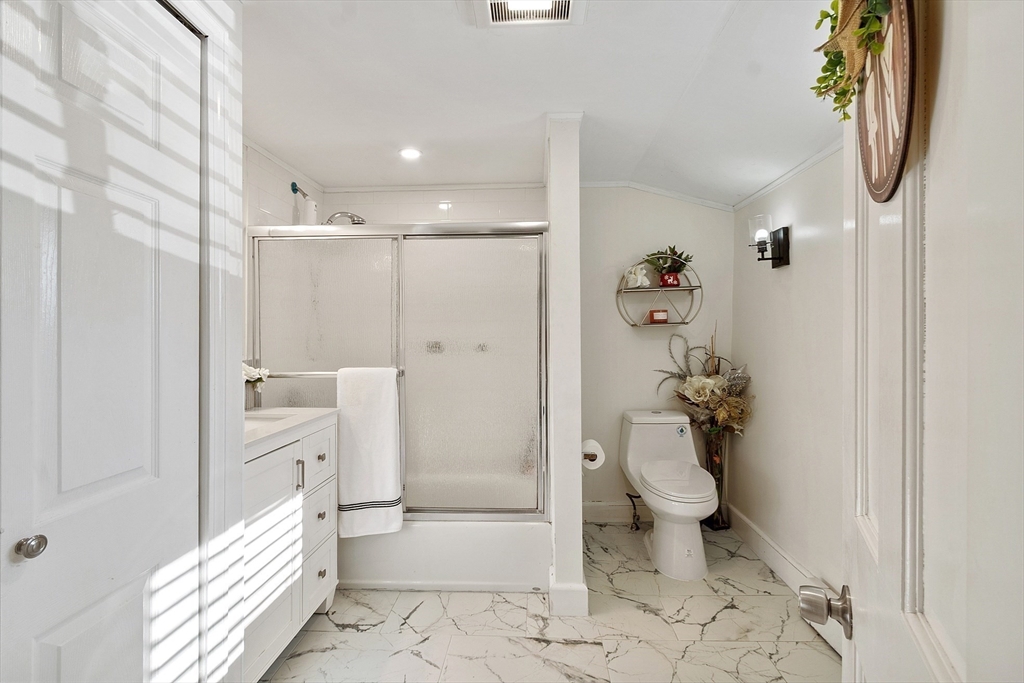 2 Grove Street Methuen, MA 01844 - Photo 22 of 38 a bathroom with a granite countertop shower and a toilet