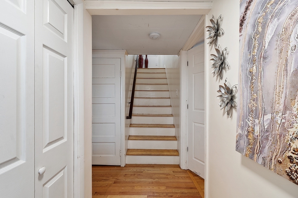 2 Grove Street Methuen, MA 01844 - Photo 5 of 38 a view of entryway with stairs and wooden floor
