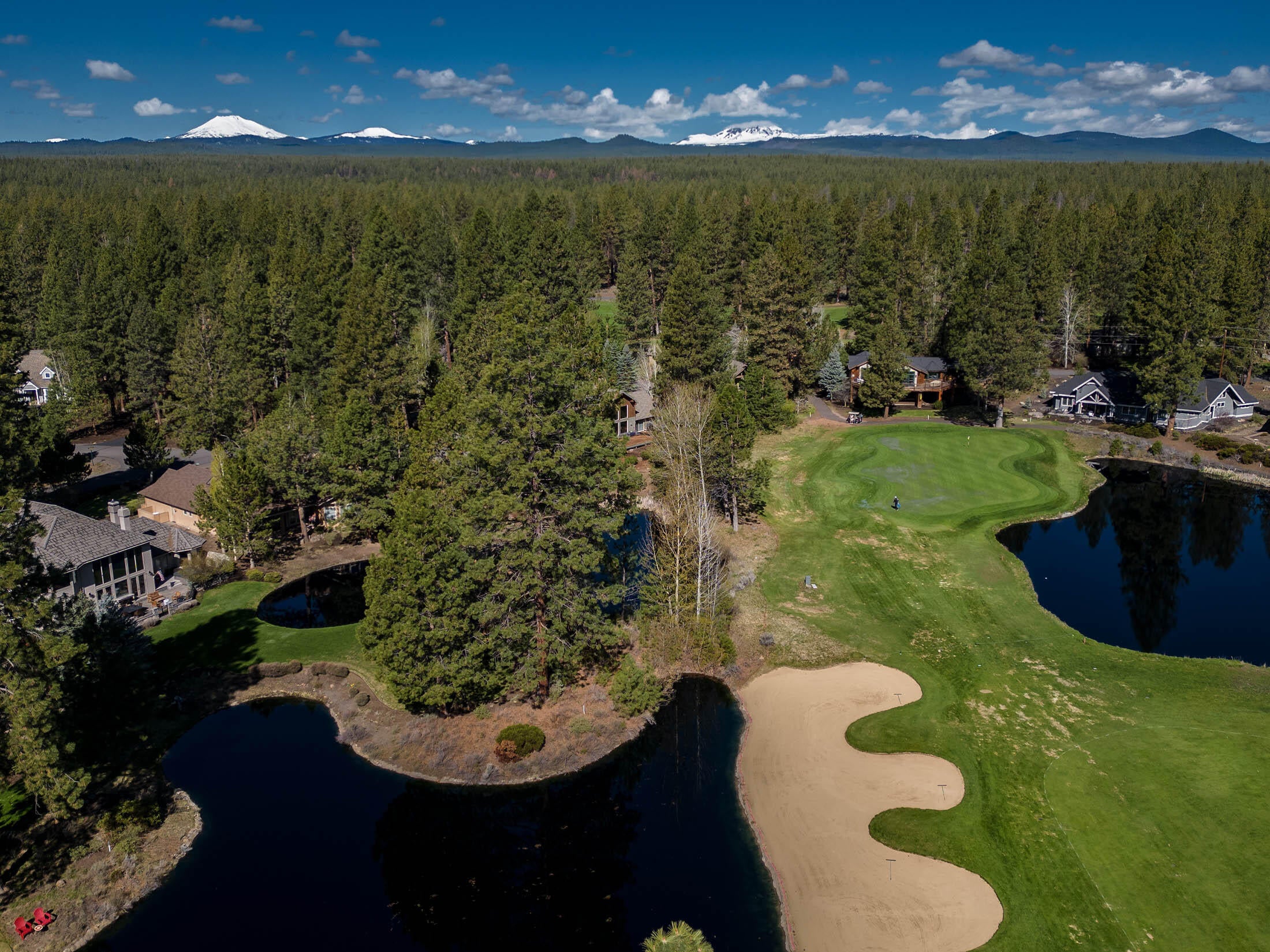 60711 Golf Village Loop Bend, OR 97702 - Photo 26 of 31 Drone photo from above lot toward the 6th green and the snow capped Cascade Mountains