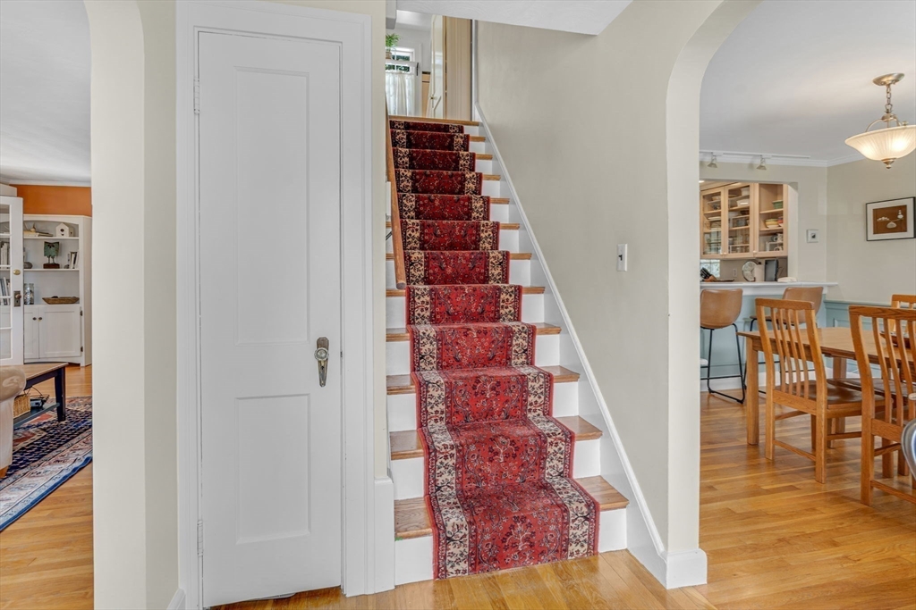 10 Stevens Terrace Arlington, MA 02476 - Photo 18 of 31 wooden floor with white walls and stairs