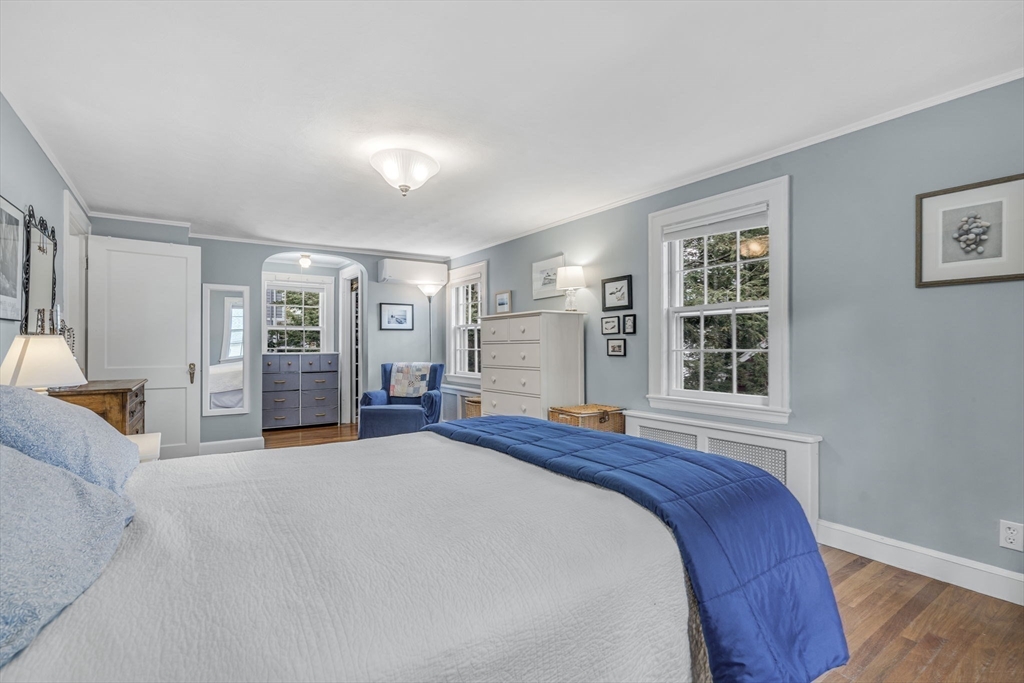 10 Stevens Terrace Arlington, MA 02476 - Photo 19 of 31 a bed room with a bed and a couch