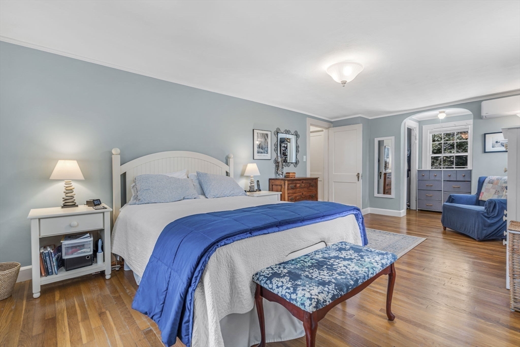 10 Stevens Terrace Arlington, MA 02476 - Photo 20 of 31 a bedroom with a bed and wooden floor