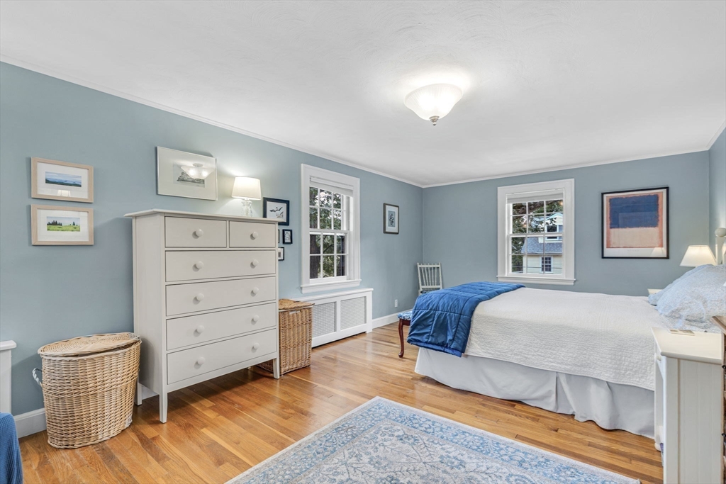 10 Stevens Terrace Arlington, MA 02476 - Photo 21 of 31 a bedroom with a bed and cabinets