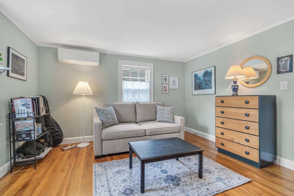 10 Stevens Terrace Arlington, MA 02476 - Photo 22 of 31 a living room with furniture and a wooden floor