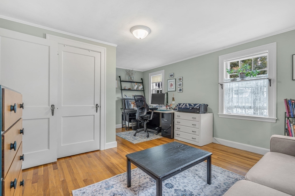 10 Stevens Terrace Arlington, MA 02476 - Photo 24 of 31 a living room with furniture a rug and a window