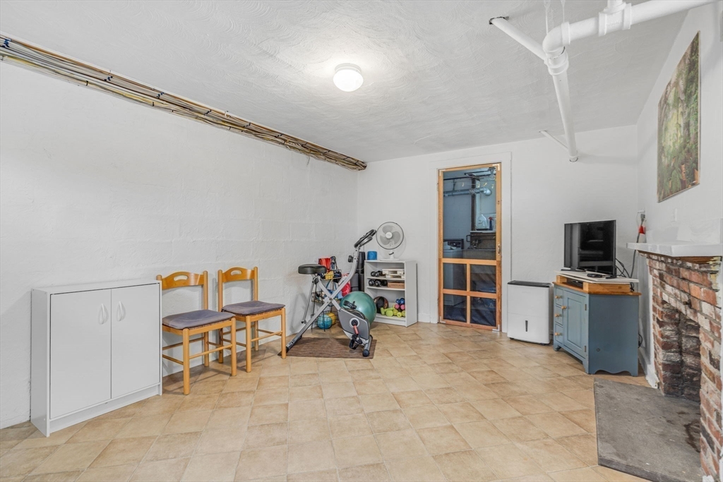 10 Stevens Terrace Arlington, MA 02476 - Photo 27 of 31 a view of a livingroom with furniture and a flat screen tv