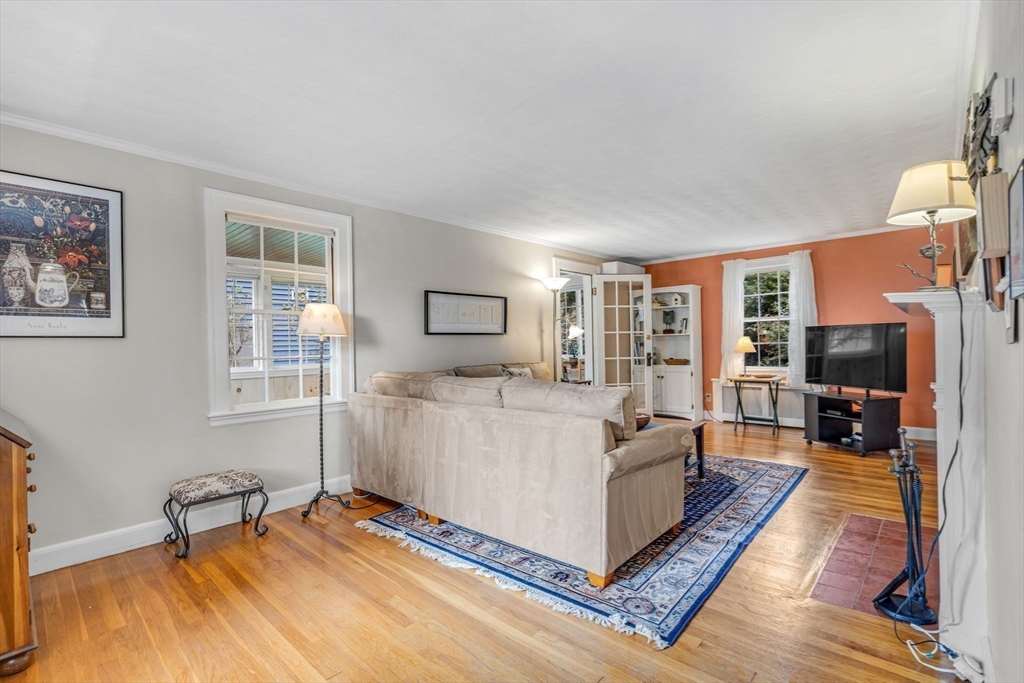 10 Stevens Terrace Arlington, MA 02476 - Photo 4 of 31 a living room with furniture and a flat screen tv