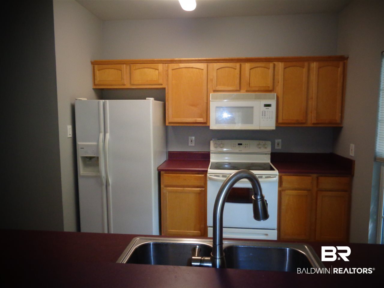 27020 Lake Road Orange Beach, AL 36561 - Photo 20 of 30 Kitchen 14x10. Tile floor. Stove,microwave