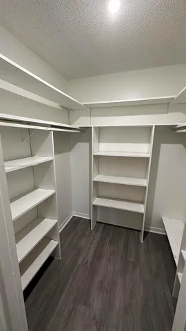 a storage room with wooden floor