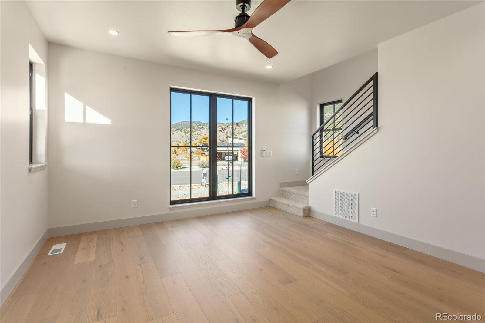 125 Confluence Road Salida, CO 81201 - Photo 18 of 48 wooden floor in an empty room with a window