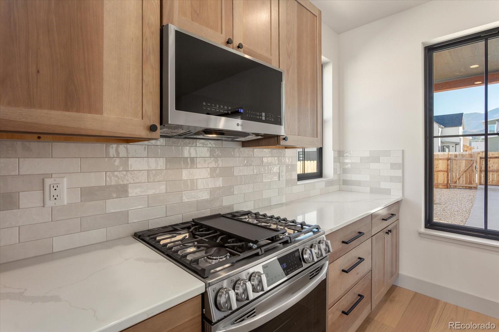 125 Confluence Road Salida, CO 81201 - Photo 22 of 48 a stove top oven sitting inside of a kitchen