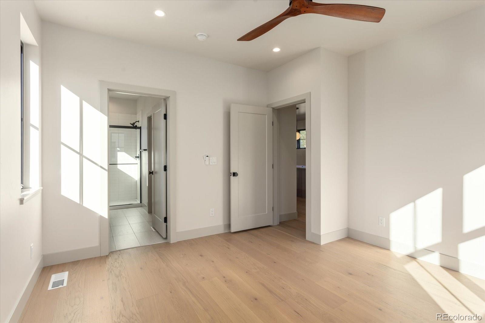 125 Confluence Road Salida, CO 81201 - Photo 27 of 48 an empty room with windows and entrance