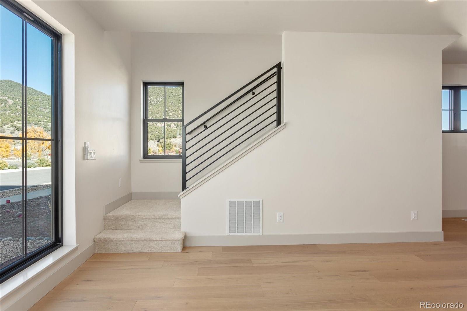 125 Confluence Road Salida, CO 81201 - Photo 31 of 48 a view of staircase with white walls and windows