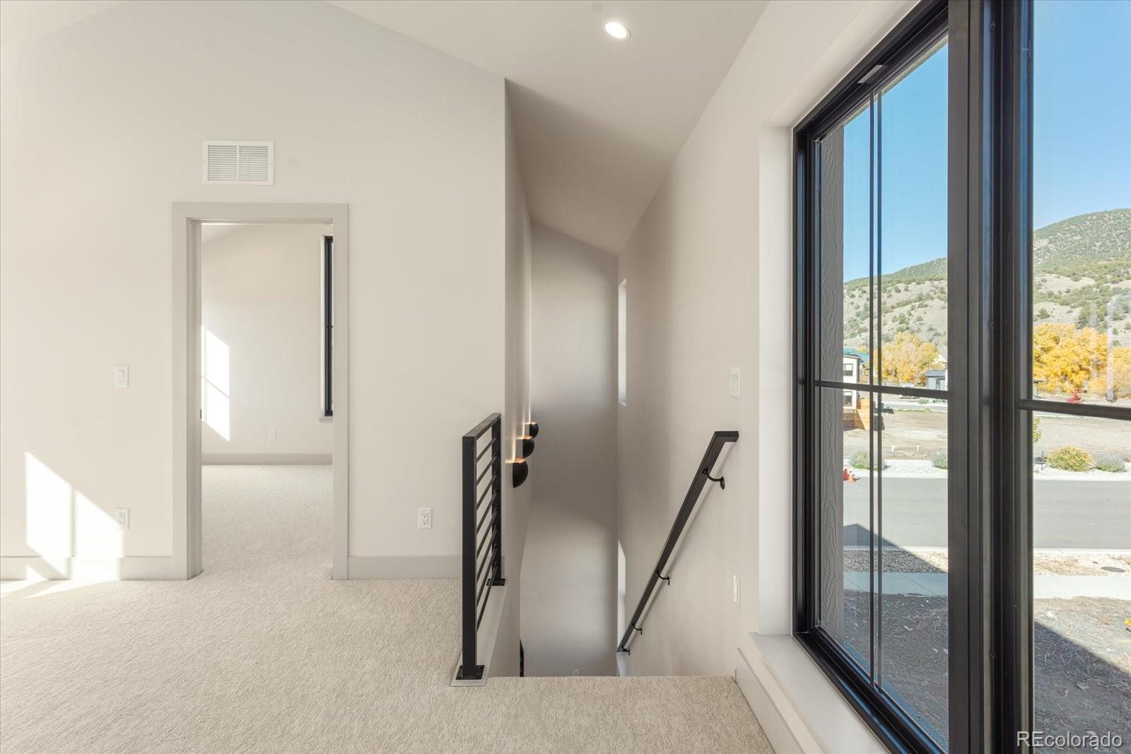 125 Confluence Road Salida, CO 81201 - Photo 32 of 48 a view of a livingroom with furniture and a floor to ceiling window
