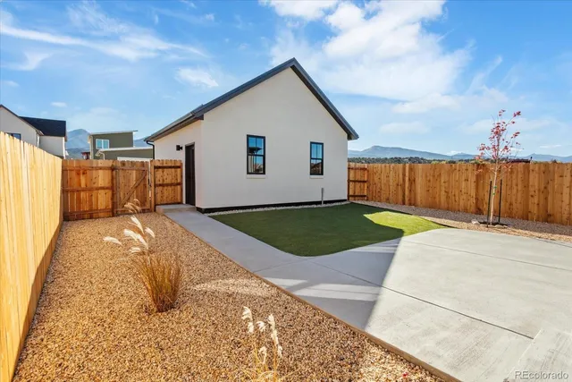 a view of a backyard with a garden