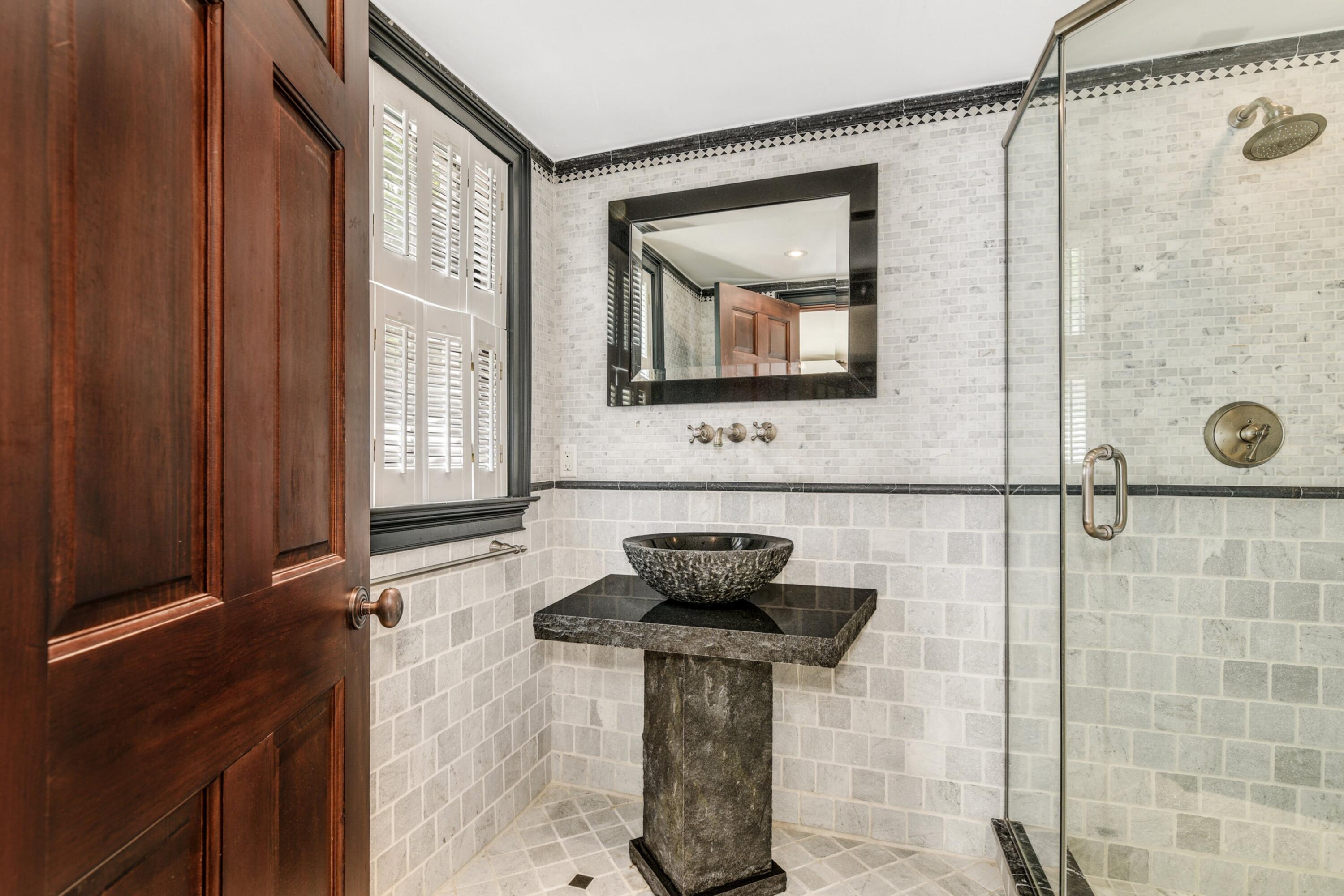 507 Trinity Pass Road New Canaan, CT 06840 - Photo 16 of 23 a bathroom with a sink a mirror and shower