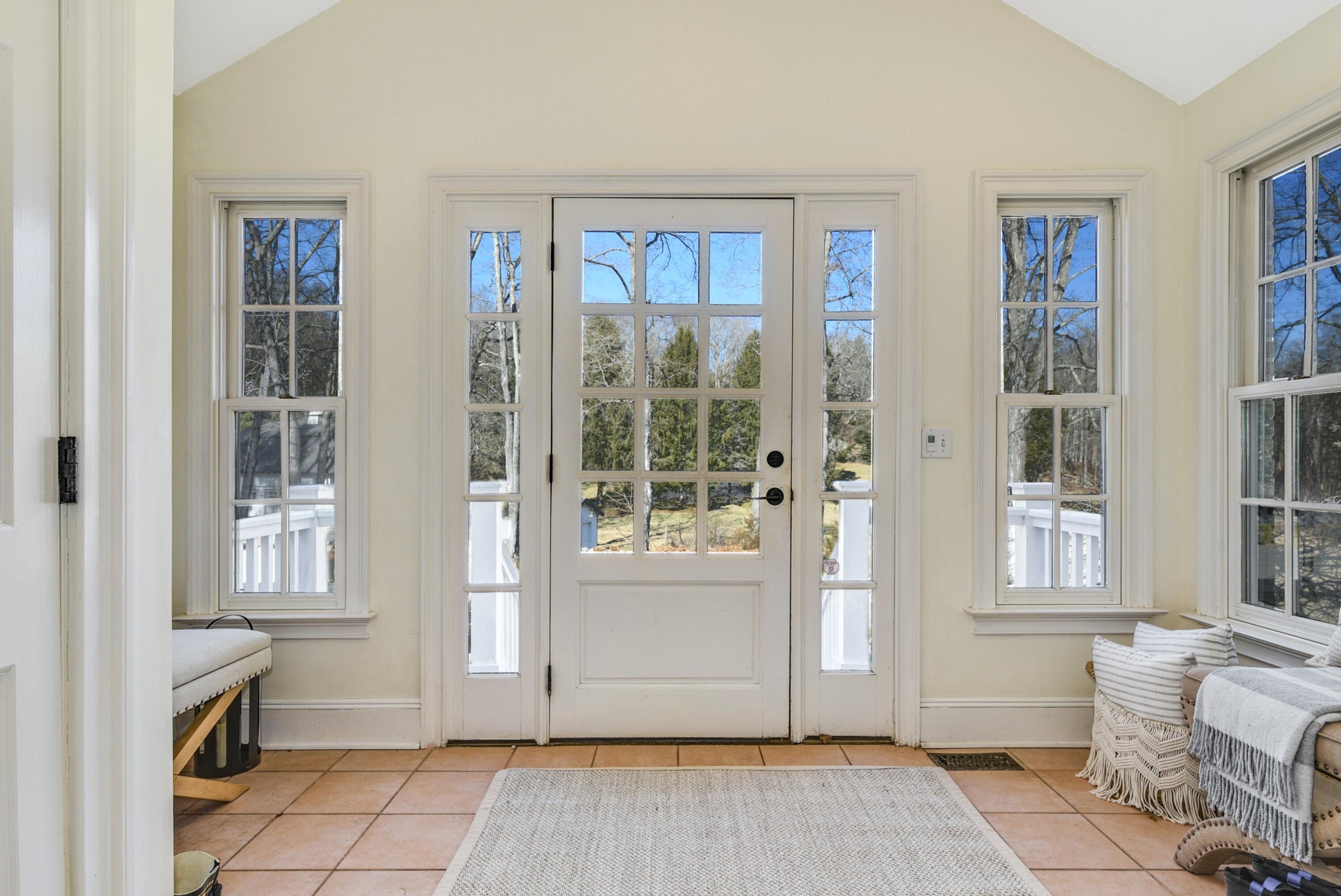 507 Trinity Pass Road New Canaan, CT 06840 - Photo 17 of 23 a view of a livingroom with furniture and windows