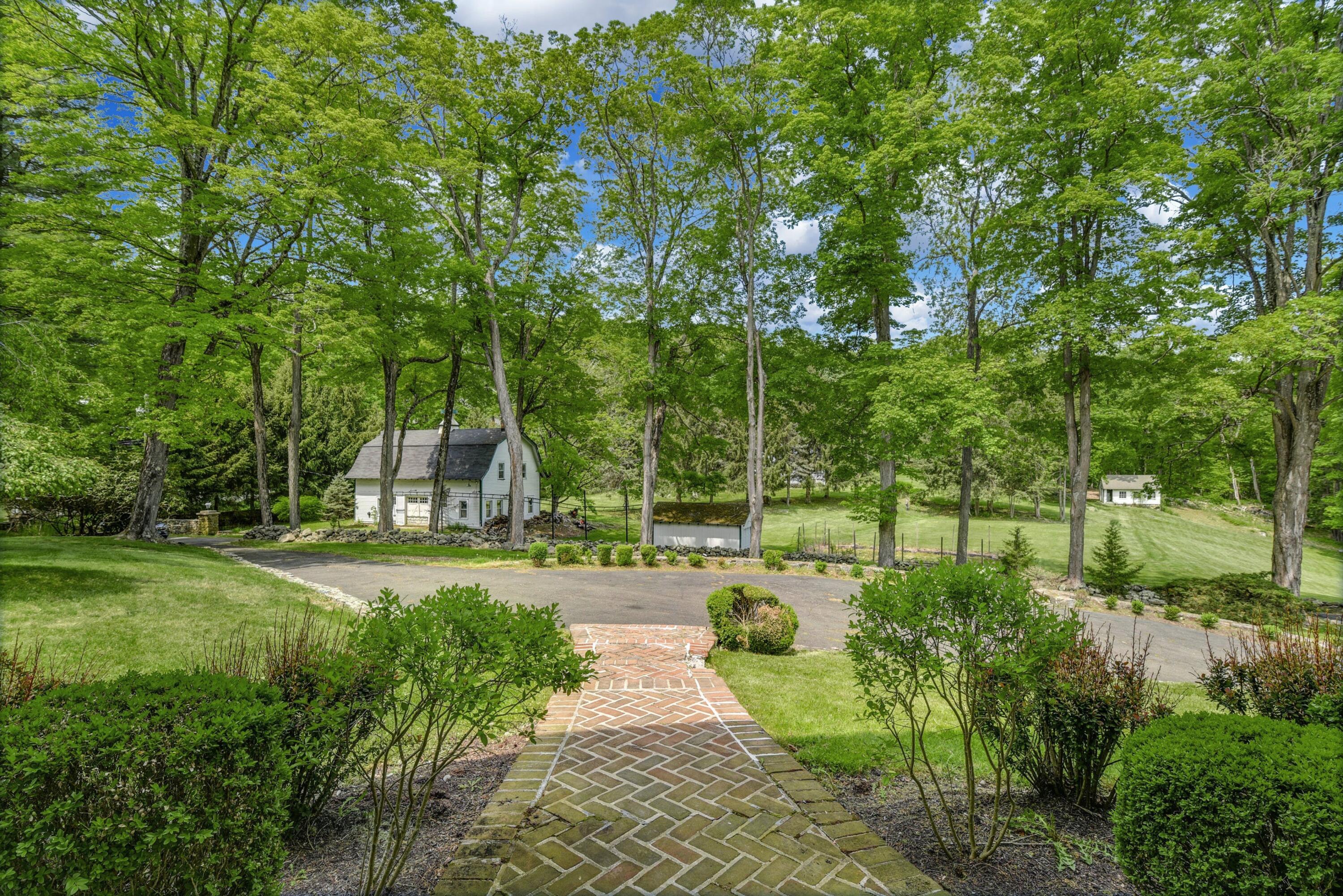 507 Trinity Pass Road New Canaan, CT 06840 - Photo 18 of 23 a view of a park with plants and trees