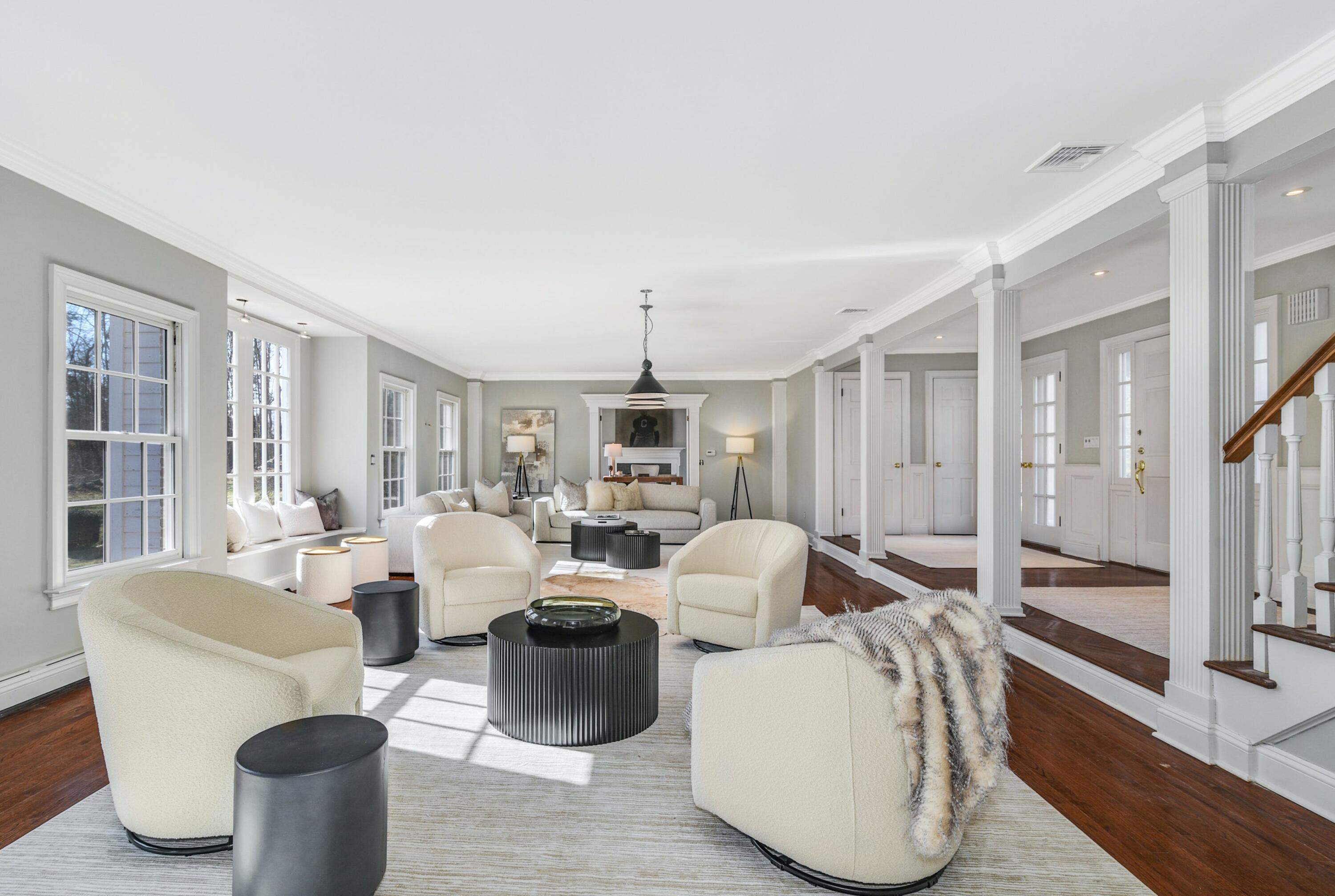 507 Trinity Pass Road New Canaan, CT 06840 - Photo 2 of 23 a living room with furniture a large window and wooden floor
