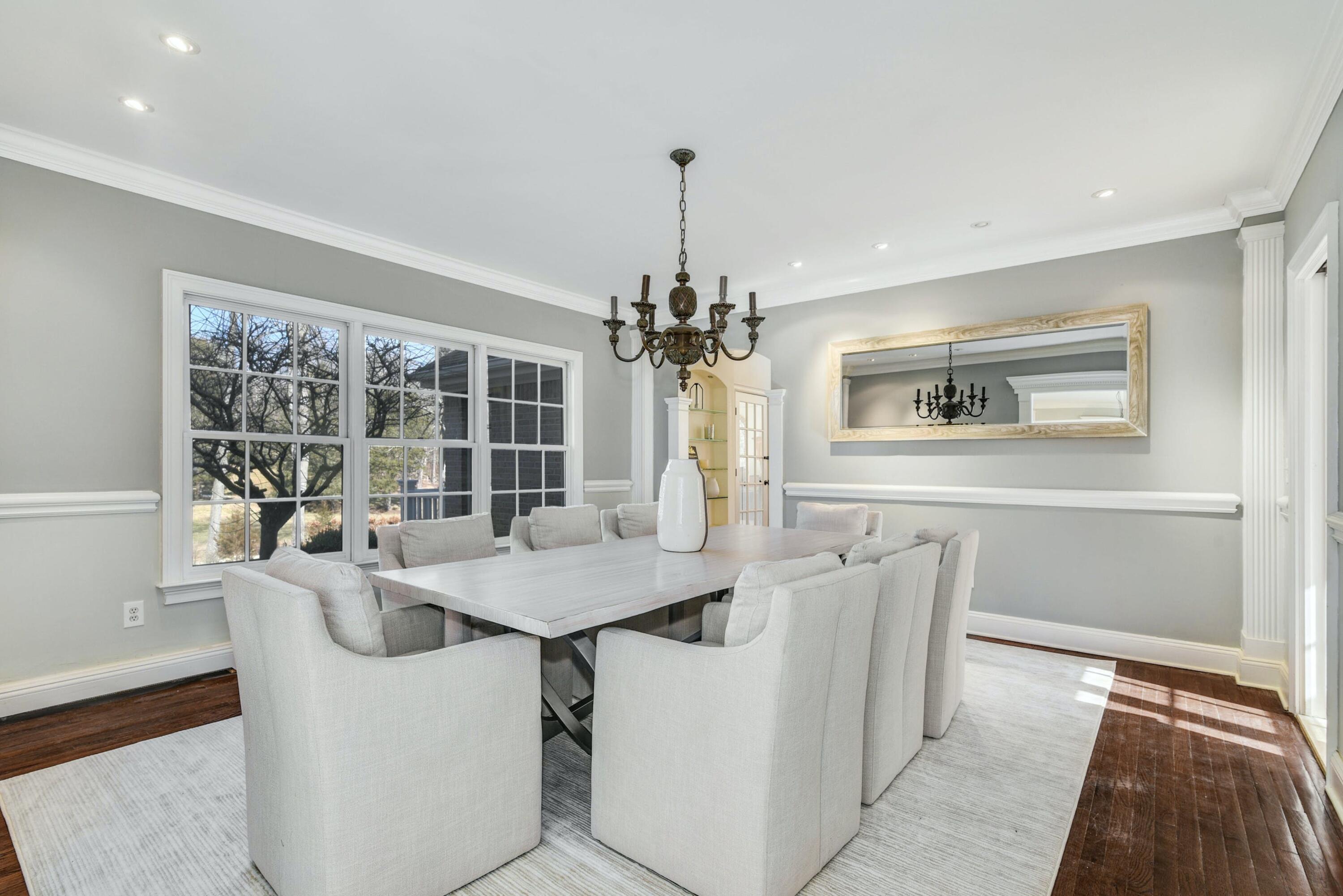 507 Trinity Pass Road New Canaan, CT 06840 - Photo 5 of 23 a dining room with furniture a chandelier and wooden floor