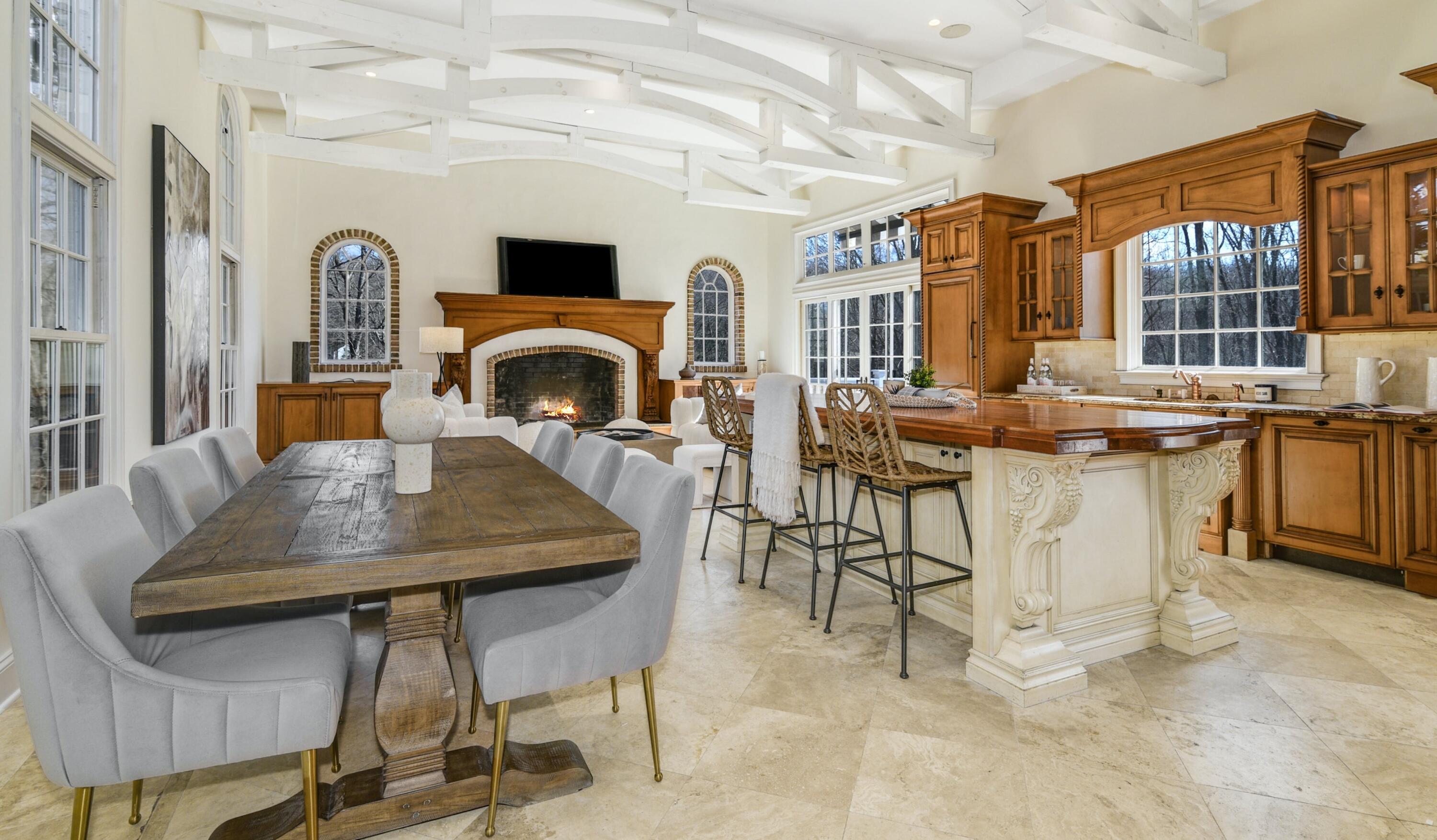 507 Trinity Pass Road New Canaan, CT 06840 - Photo 8 of 23 a view of a dining room with furniture and a fireplace