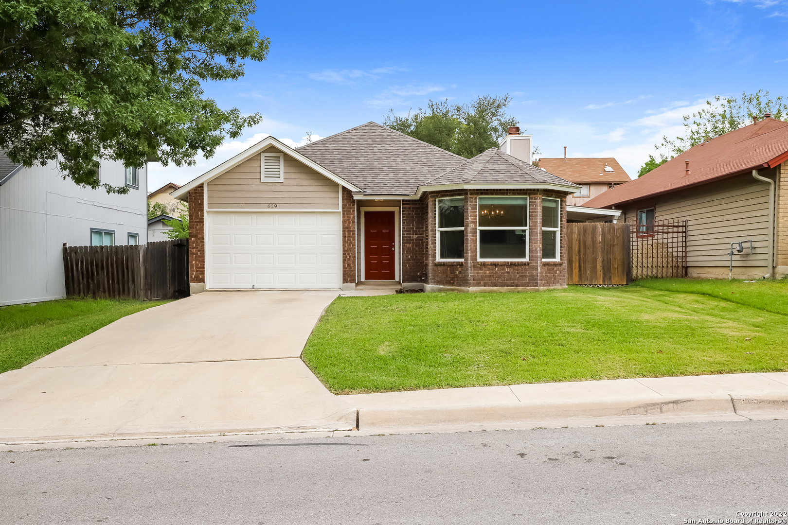 629 Meadow Gate Converse, TX 78109 - Photo 1 of 1 a front view of house with yard and green space