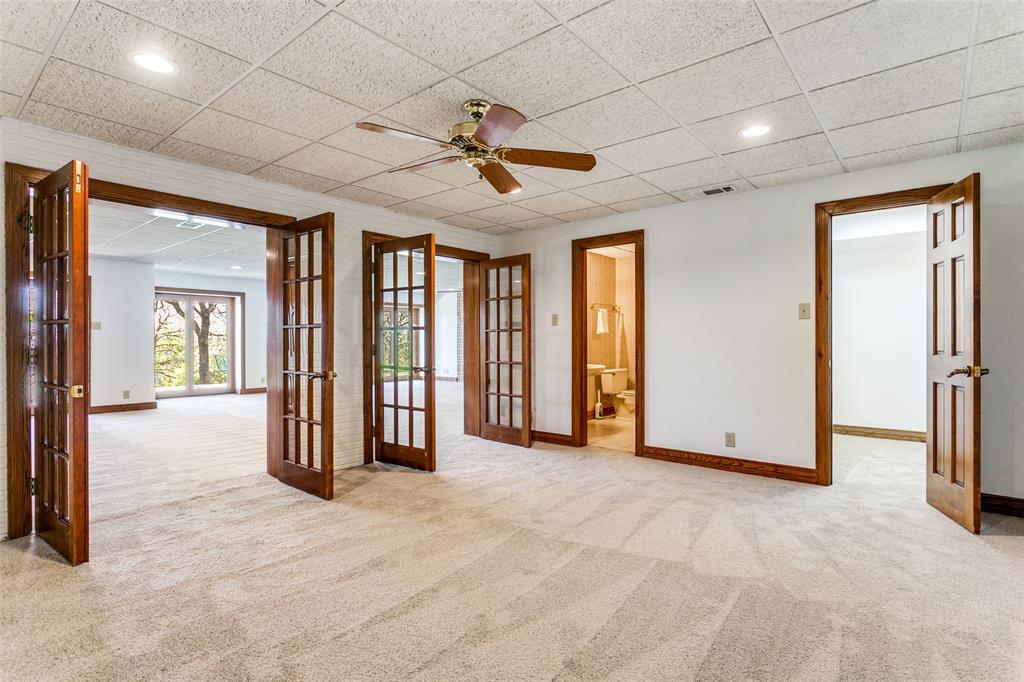 1557 Latigo Hills Road Bartonville, TX 75022 - Photo 26 of 40 Spare room with french doors, light colored carpet, a paneled ceiling, a ceiling fan, and recessed lighting