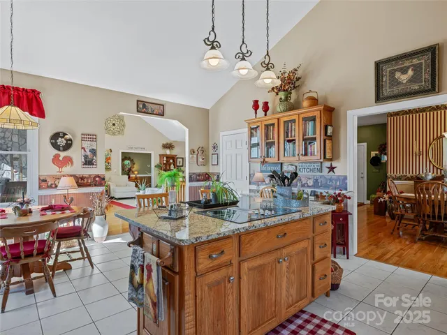 a living room with furniture a flat screen tv and a table