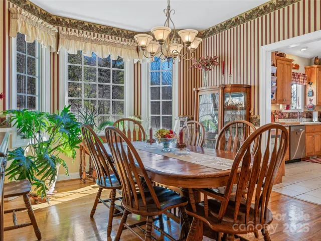 a view of a chairs and table in the balcony