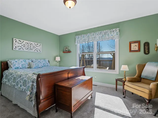 a bed room with a bed and a television