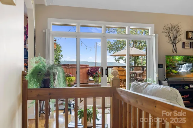 a living room with furniture flowerpot and wooden floor