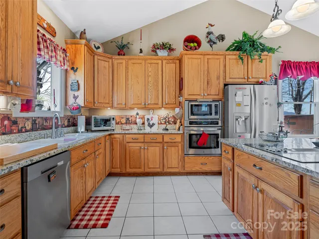 a view of a kitchen area kitchen island dining table and chairs
