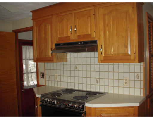 335 Evergreen Road Springfield, MA 01119 - Photo 8 of 17 a kitchen with a sink a stove and cabinets