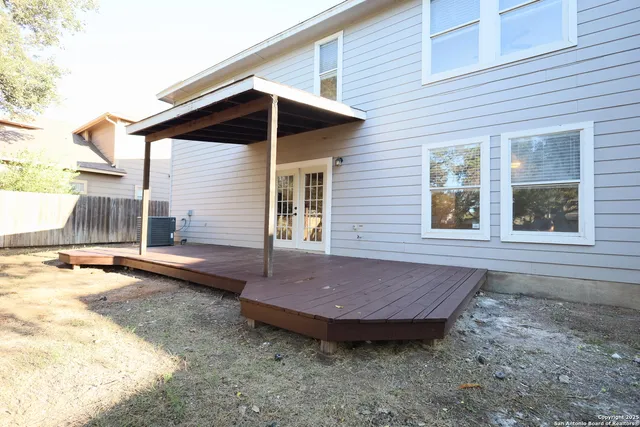 a view of a house with backyard and wooden floor
